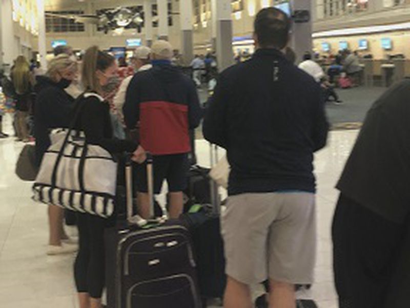Troubled travelers back home Wednesday after unexpected flight cancellations left them stranded for days