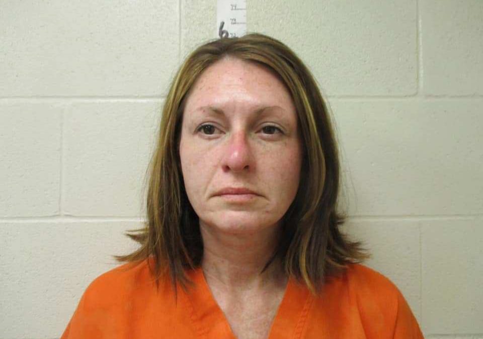 A woman was arrested by Dickinson police for assisting in the escape of two inmates from the Southwest Multi-County Correctional Center on Tuesday