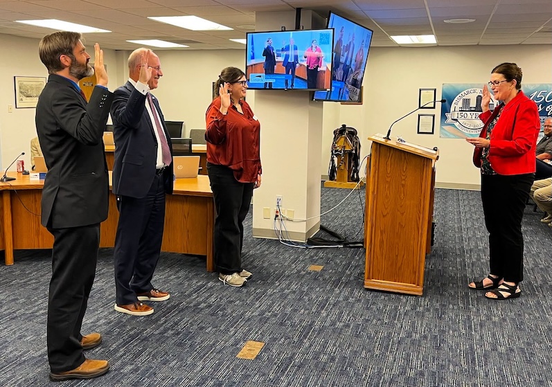 Bismarck Mayor Mike Schmitz and two city commissioners officially sworn in for new four-year terms
